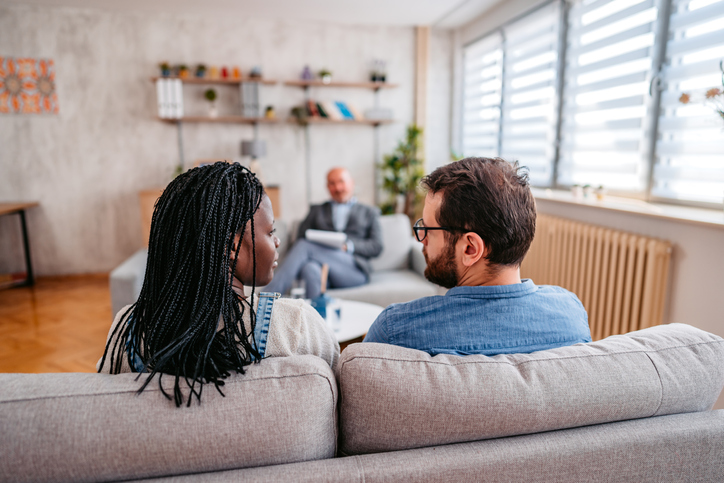 Photo shows young couple attending counseling