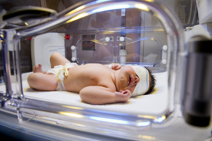 Photo shows newborn in an incubator