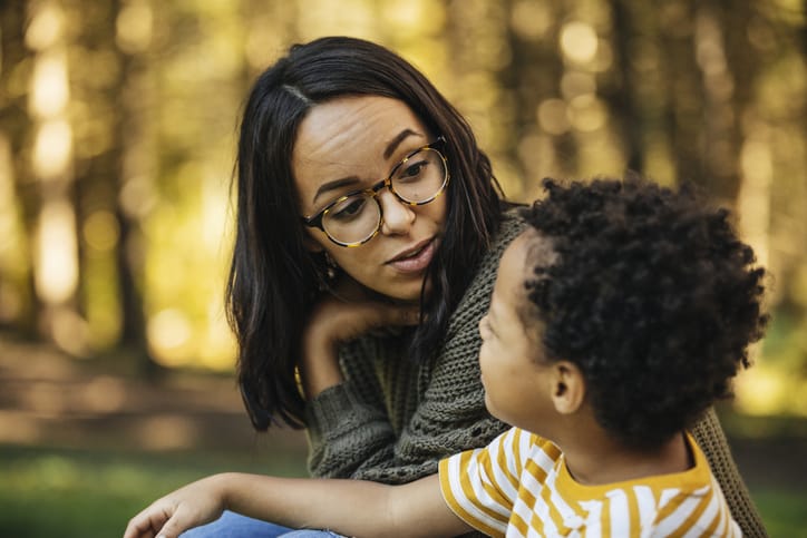 Photo shows a mother and son talking outside/Getty Images